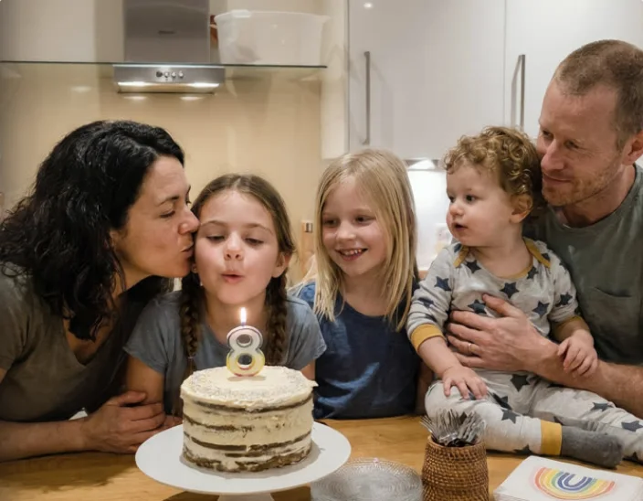 The cover of Mila is 8, a family photo album gift shared as a link in a message to Grandma.
